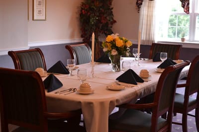 Set dining table in a well-lit dining room