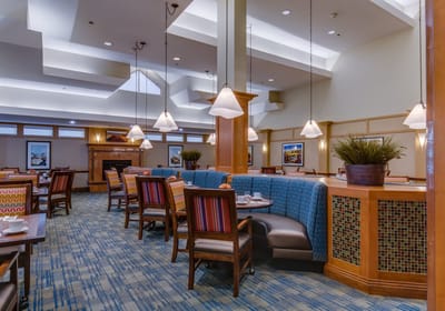 Bright dining area with booths and tables