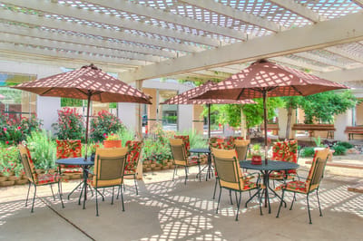 Outdoor seating area with umbrellas and flowers