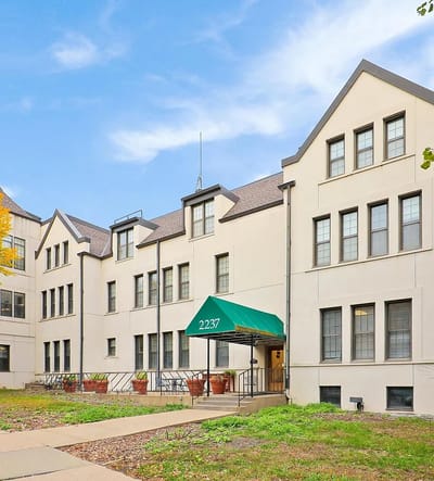 Exterior view of a nursing home facility with green awning