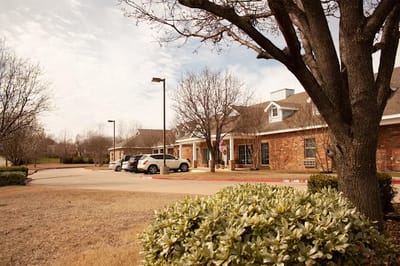 Exterior view of the Abba Care facility with landscaping