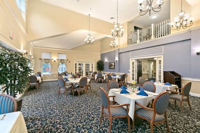 Elegant dining room setup with tables and chairs
