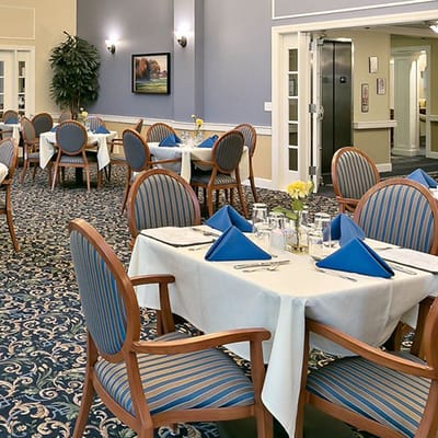 Elegant dining room with tables set for a meal