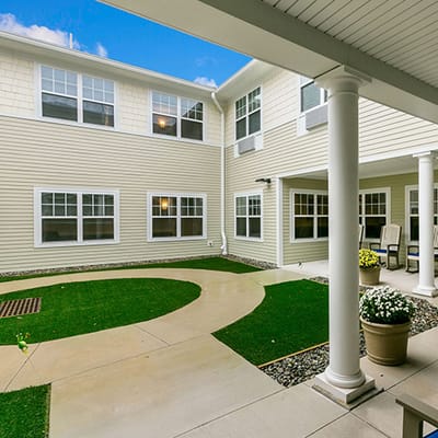 Courtyard view of an assisted living facility with gardens