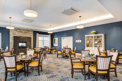 Bright dining room with tables set for meals