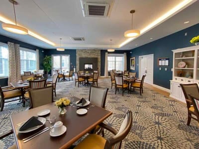 Well-furnished dining room with tables and chairs