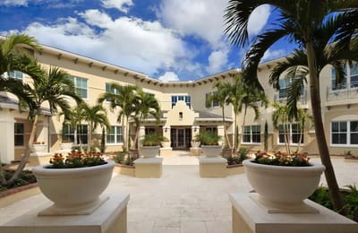 Courtyard of Bayshore Memory Care with landscaped gardens and seating