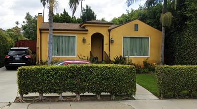 Exterior view of a residential care facility with garden