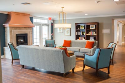 Cozy lounge area with a fireplace and seating