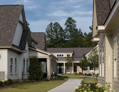 Pathway through landscaped grounds of a senior living facility
