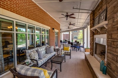 Covered patio area with comfortable seating