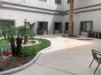 Outdoor courtyard with seating and a fountain