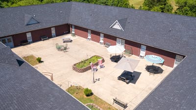 Aerial view of an outdoor courtyard with seating areas