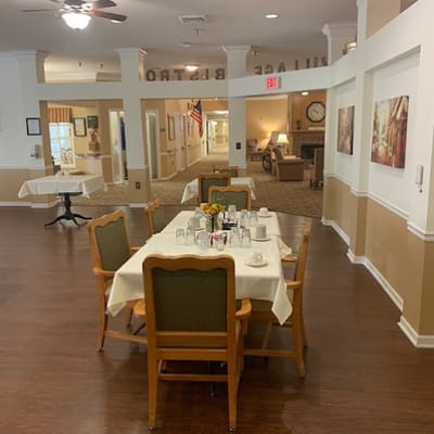 Dining area with tables and chairs set for meals