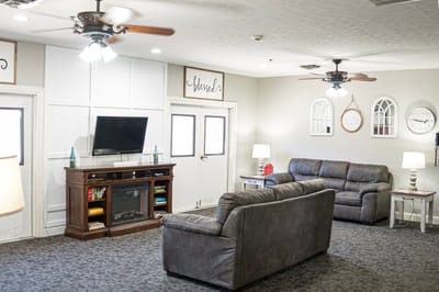 Cozy common area with sofas and TV
