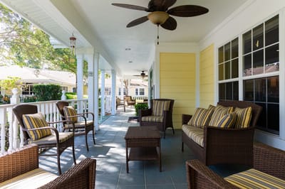 Outdoor seating area with comfortable chairs on a porch