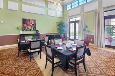 Elegant dining room set for a meal with flowers