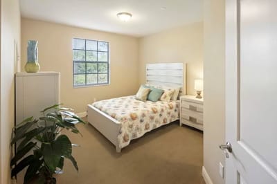 Cozy private room with floral bedding and natural light