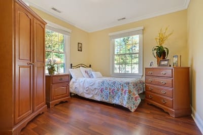Cozy private resident room with a bed and furniture