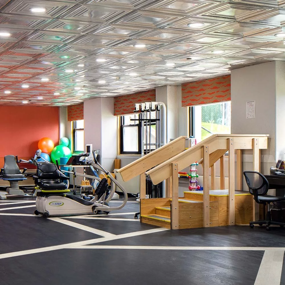 Interior view of a physical therapy gym with equipment