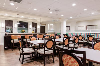 Bright dining area with tables and chairs