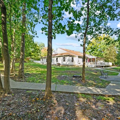Exterior view of the facility surrounded by trees