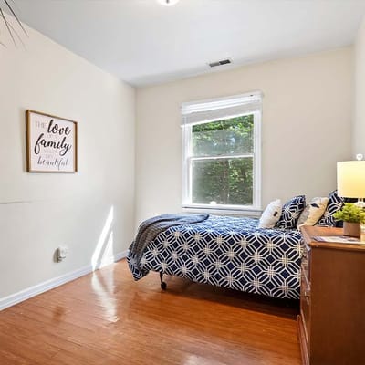 Cozy private resident room with a bed and window