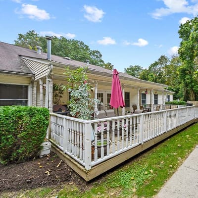 Exterior view of an assisted living facility with patio