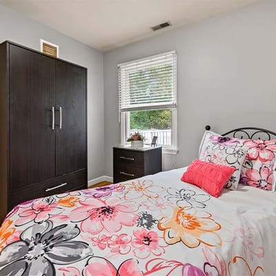 Brightly decorated resident room with floral bedding