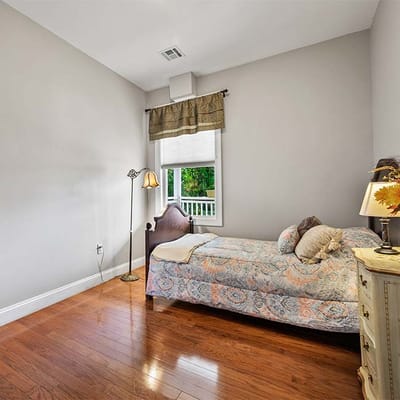 Comfortable private resident room with wooden floor