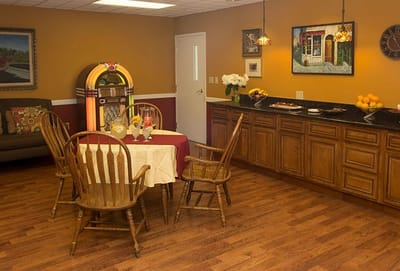 Cozy dining room with wooden chairs and jukebox