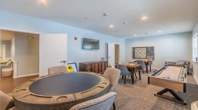 Common area with gaming tables and comfortable seating