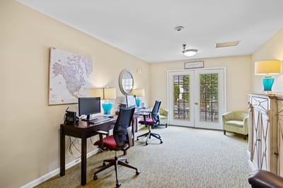 Bright activity room with computers and workstations