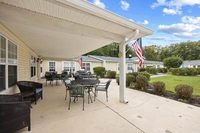 Outdoor patio area with seating and American flags