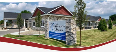 Exterior view of Hampton Manor building with signage
