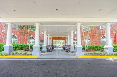Entrance area with rocking chairs and landscaping