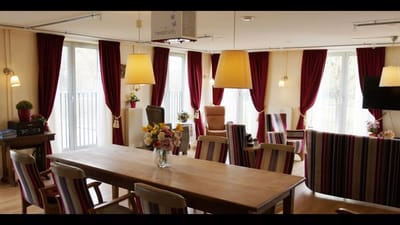Interior view of a bright common area with seating