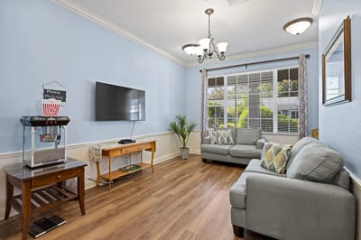 Bright common area with cozy seating and entertainment