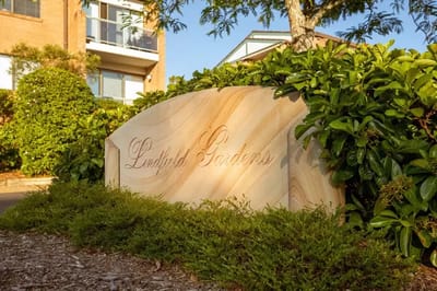 Sign for Lindfield Gardens Retirement Living among greenery