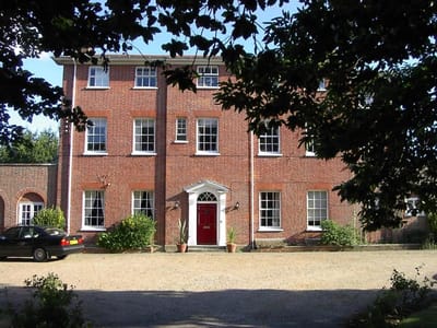 Exterior view of a nursing home with brick facade