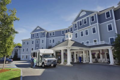 Exterior view of Methuen Village with transport van