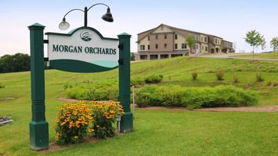 Exterior view of the Morgan Orchards Senior Living Community sign and building