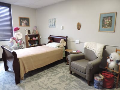 Cozy resident room with bed and seating area