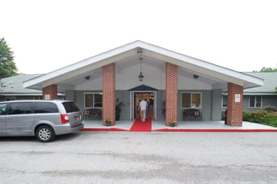 Front entrance of Oakwood Care Center with a resident entering