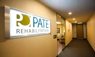 Interior hallway of Pate Rehabilitation Center with signage