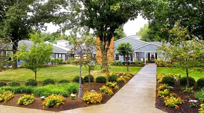 Beautifully landscaped outdoor space with pathways and flowers