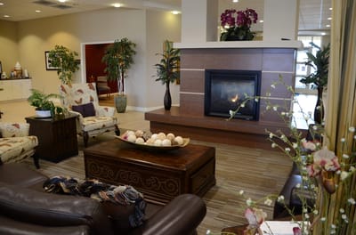 Welcoming lobby area with fireplace and seating