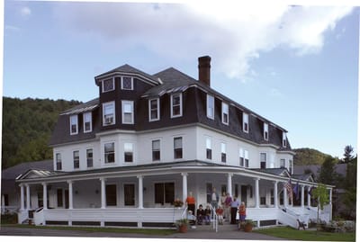 Exterior view of Park House with residents on the porch