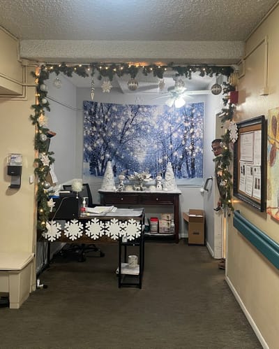 Festively decorated reception area with snowy backdrop