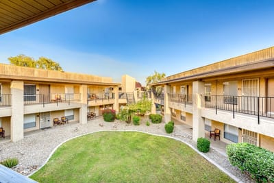 Courtyard view of the facility with seating and greenery